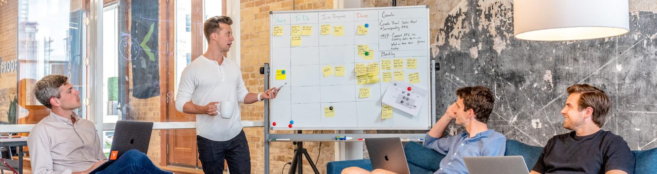 a team of four people planning a website